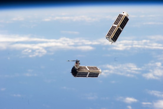 File:Doves launched from ISS float against Earth horizon s.jpg